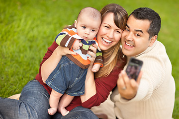 Image showing Happy Mixed Race Parents and Baby Boy Taking Self Portraits