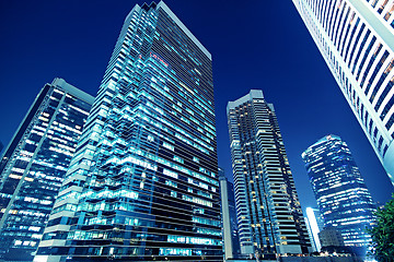 Image showing Tall office buildings by night 