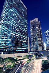 Image showing Tall office buildings by night 