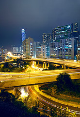 Image showing Colorful city night with buildings and bridge