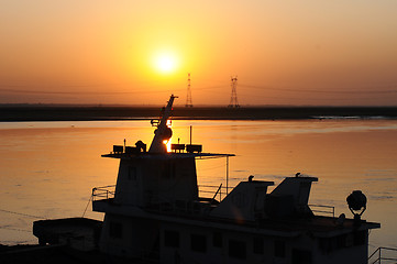 Image showing Silhouette of a ship at sunset