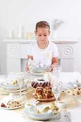 Image showing Girl setting table