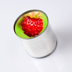 Image showing wild strawberry into a  can