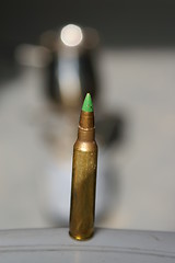 Image showing A bullet on a table