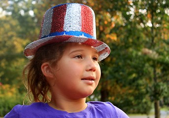 Image showing Little girl in 4t of july hat