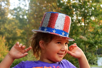 Image showing Little girl in 4t of july hat
