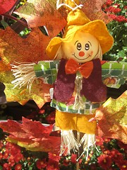 Image showing Halloween scarecrow on bale of hay