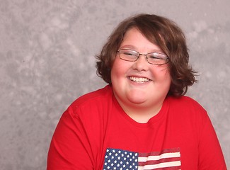 Image showing Handsome young man in red shirt smiling