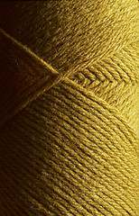 Image showing Skein of gold wool knitting yarn