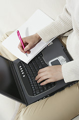 Image showing Woman typing with laptop
