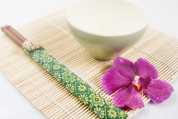 Image showing Chopsticks, Bowl, and Orchid