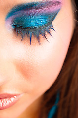 Image showing closeup photo of a girl with beautiful makeup and selected focus