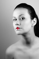 Image showing Black and white ohoto of a girl with medical lipstick