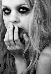 Image showing A depressed young girl in black and white