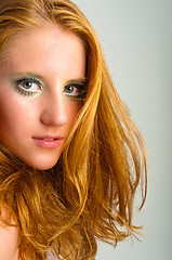 Image showing autumnal makeup on a young model against isolated white backgrou