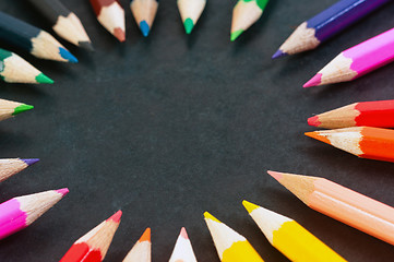 Image showing Colorful pencils on dark background in a circle