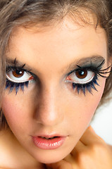 Image showing young beautiful girl with extreme makeup on white isolated backg