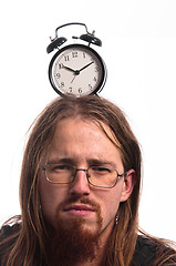 Image showing Handsome man with clock on his head