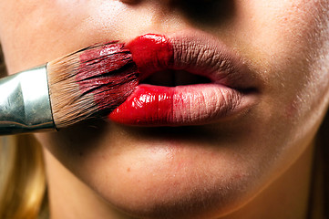 Image showing Conceptual makeup with a little bit of red paint