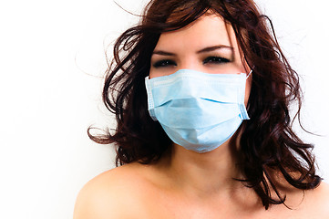 Image showing A girl in a protective mask against white isolated background