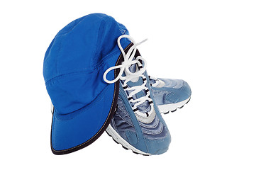 Image showing sports shoes and Cap isolated on white 