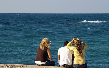 Image showing Happy friends on a sea shore