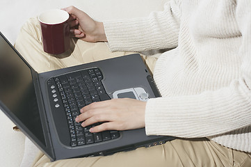 Image showing Woman typing with laptop