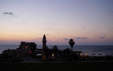 Image showing old minaret in a sunset sea