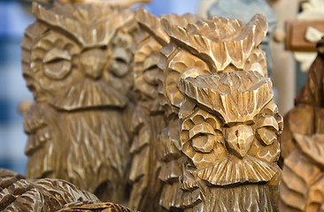 Image showing Owl figurines carved of wood. Handmade wares.