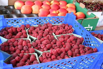 Image showing Raspberries,peaches and cherries in market stall