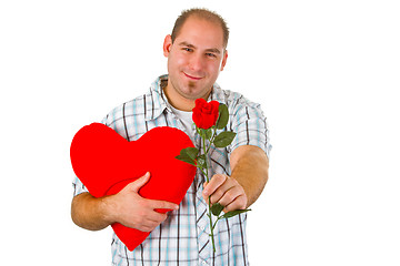 Image showing Young man holding red heart