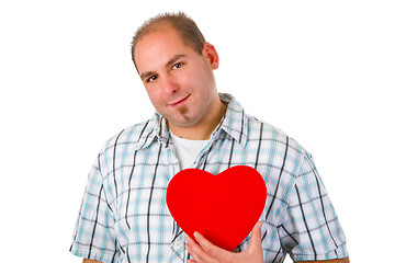 Image showing Young man holding red heart