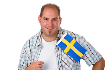Image showing Young man holding swedish flag