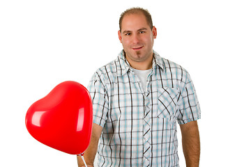 Image showing Young man holding red heart