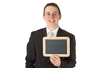 Image showing Businessman holding a black board