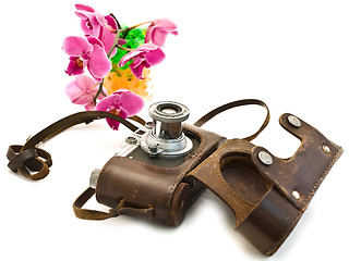 Image showing photocamera and pink orchid