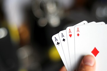 Image showing hand holding four aces