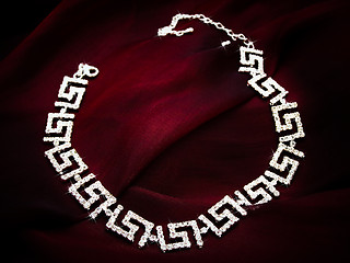 Image showing necklace at red fabric