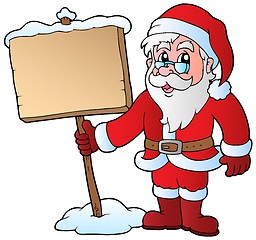 Image showing Santa Claus holding wooden board