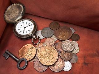 Image showing Old clock, key and coins