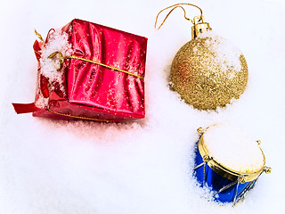 Image showing christmas toys in snow