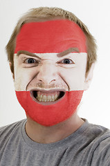 Image showing Face of crazy angry man painted in colors of austria flag