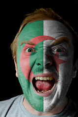 Image showing Face of crazy angry man painted in colors of algeria flag