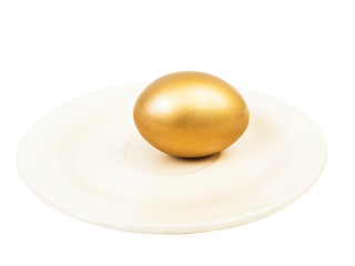 Image showing golden egg at plate