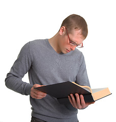 Image showing a young man reading a great book