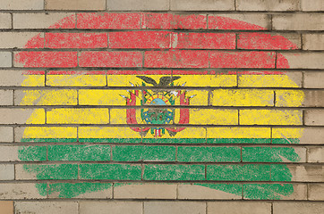 Image showing flag of bolivia on grunge brick wall painted with chalk  
