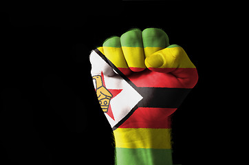 Image showing Fist painted in colors of zimbabwe flag