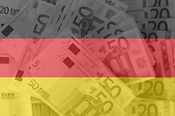 Image showing flag of Germany with transparent euro banknotes in background 