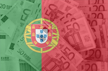 Image showing flag of Portugal with transparent euro banknotes in background 