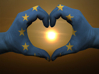 Image showing Heart and love gesture by hands colored in eu flag during beauti